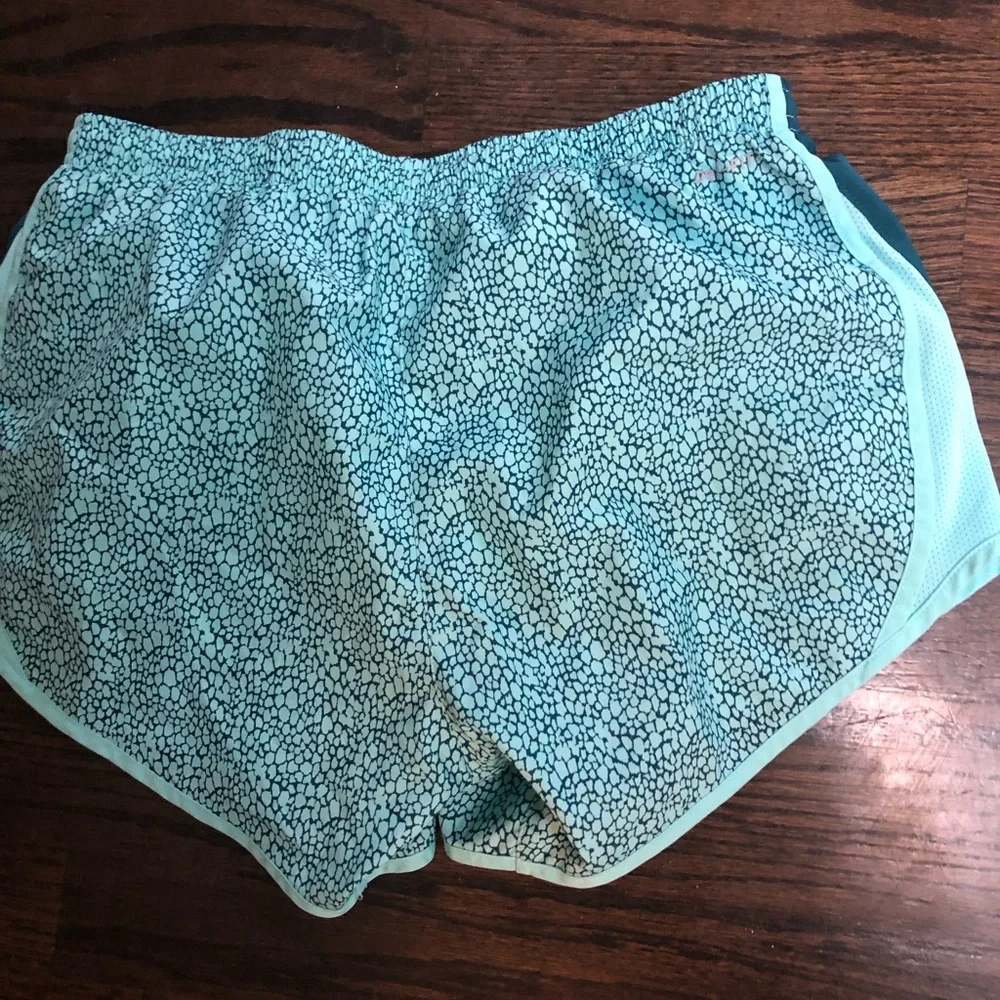- Nike running shorts. Aqua and teal. Size Small